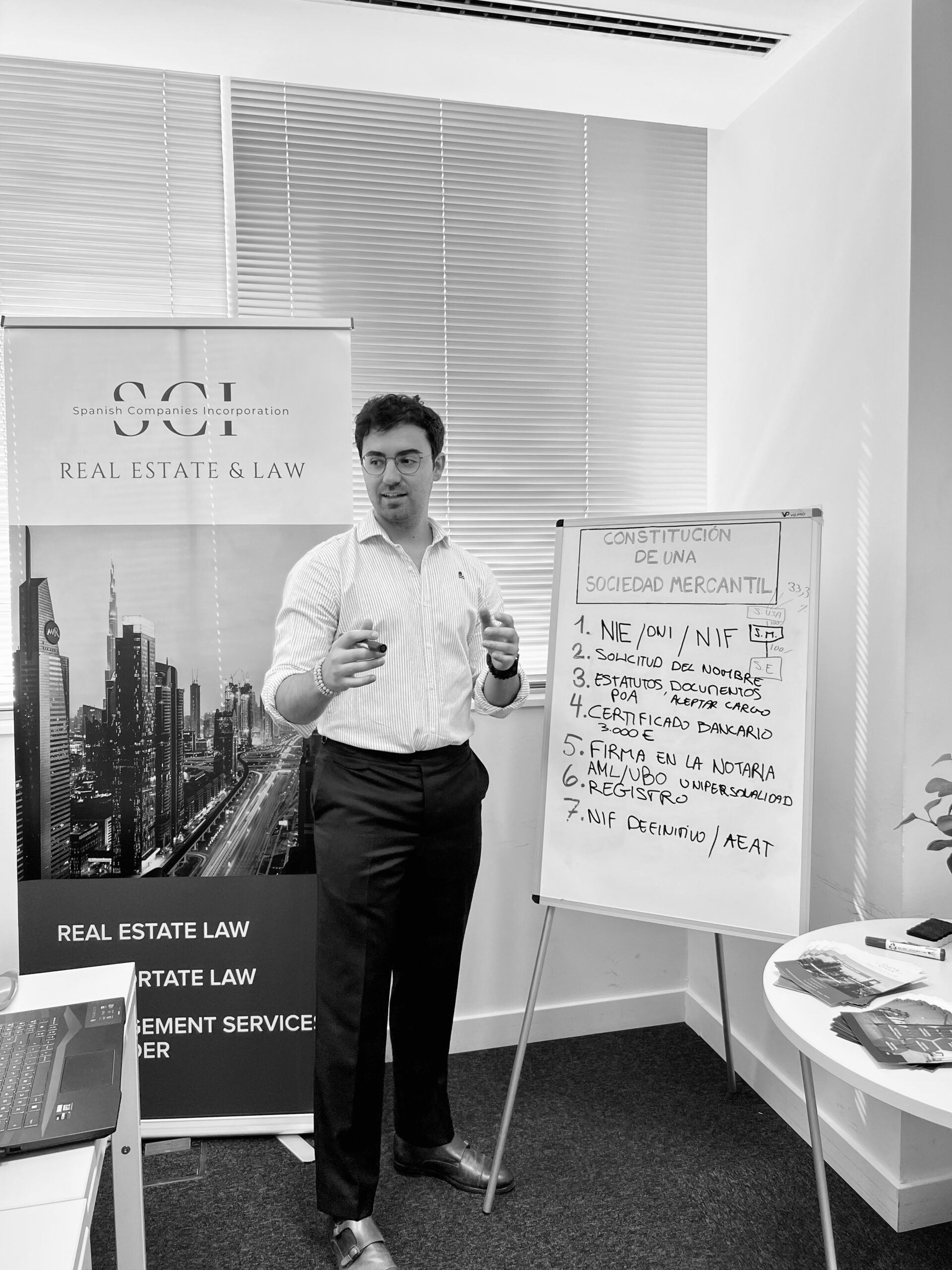 Alejandro Cayuela explaining a legal process to clients